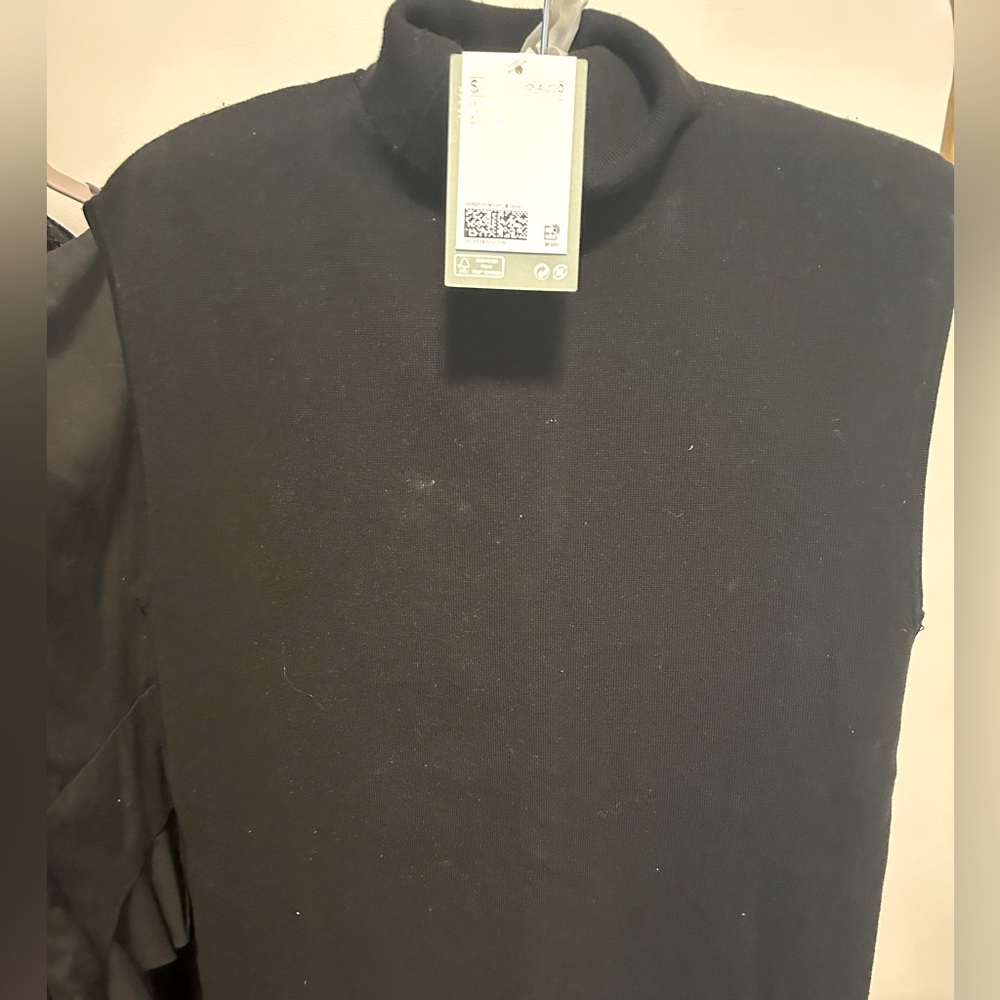 Long black turtleneck sleeveless dress